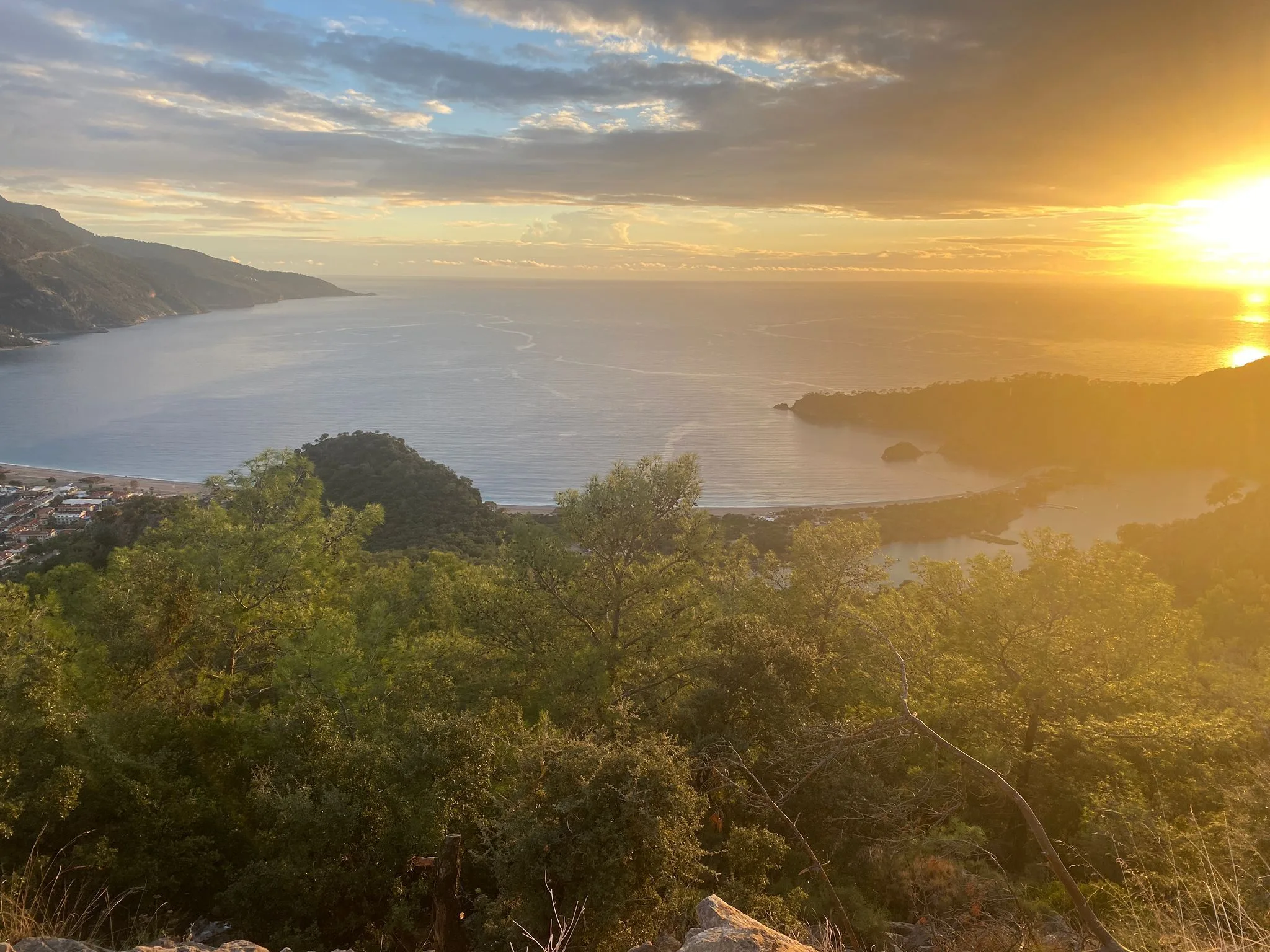 A broad coastal bay at sunset