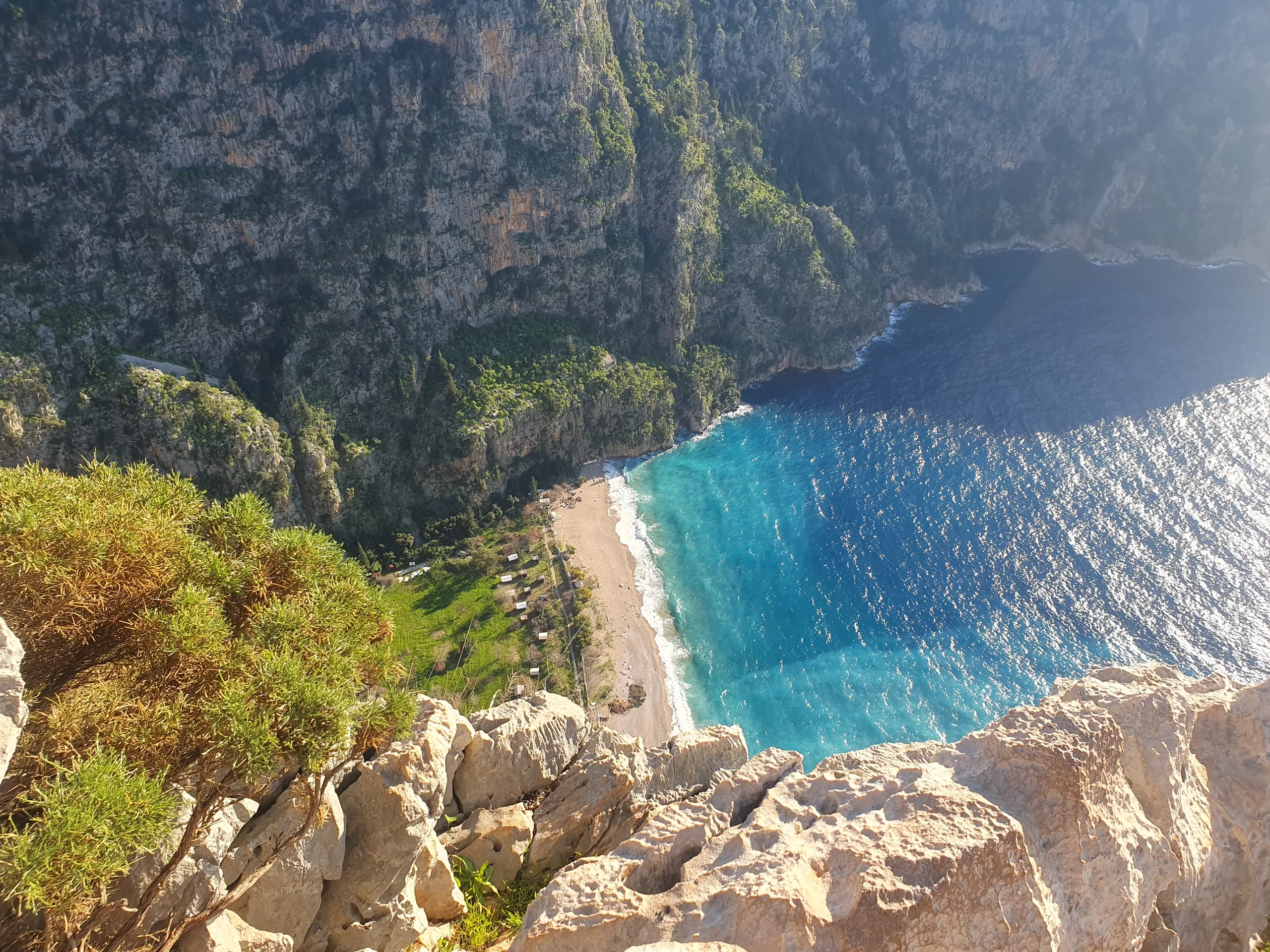 Cliffs overlooking the beach and turquoise waters of Butterfly Valley near Ölüdeniz